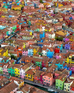 Picturesque Burano with its  brightly colored fishermen's houses .
: .
